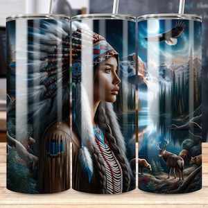 May include: A set of three stainless steel tumblers with a Native American theme. The tumblers feature a woman in a headdress, a mountain scene, and a bald eagle flying over a lake.