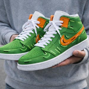 green jordans with orange laces