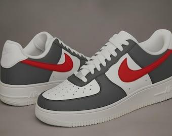 May include: Pair of gray, white, and red Nike Air Force 1 sneakers. The sneakers feature a white base with gray overlays and a red Nike swoosh. The soles are white, and the shoes are laced with white laces.