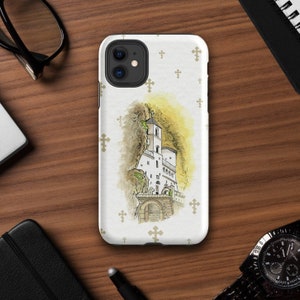 May include: A white iPhone case featuring a watercolour illustration of a white building with a tower and crosses on a white background.