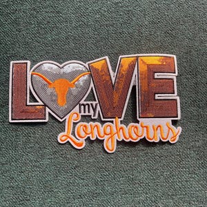 May include: Orange and white embroidered patch with the words "Love my Longhorns" and a heart with a Longhorn steer silhouette.
