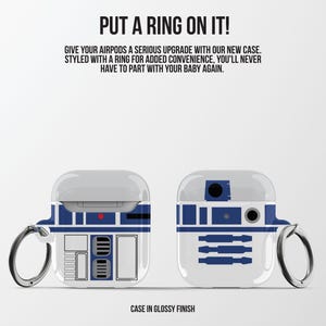 May include: Two white and blue AirPod cases with a glossy finish, featuring a design reminiscent of a popular droid character. Each case has a silver ring for attachment. Text on the image reads "PUT A RING ON IT!" and "CASE IN GLOSSY FINISH."