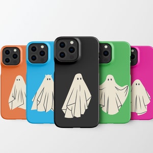 May include: Five different phone cases with a ghost design. The cases are orange, blue, black, green, and pink.