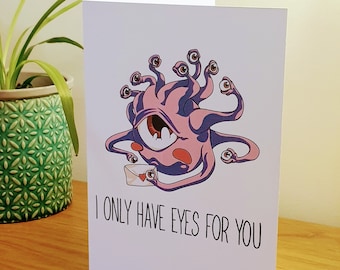May include: A pink and white greeting card with a cartoon monster with multiple eyes holding a letter that says "I only have eyes for you".