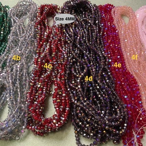 May include: Assortment of 4mm crystal beads in various colours, including green, silver, red, purple, pink, and light pink. The beads are arranged in rows and labelled with letters and numbers, such as 4a, 4b, 4c, 4d, 4e, 4f, and 4g. The text "Size 4MM" is also visible in the image.