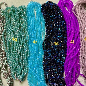 May include: Six strands of faceted glass beads in various colours, including grey, teal, light blue, dark blue, purple, and light grey. The strands are labelled with the letters 'p', 'q', 'r', 's', 't', and 'grey'.