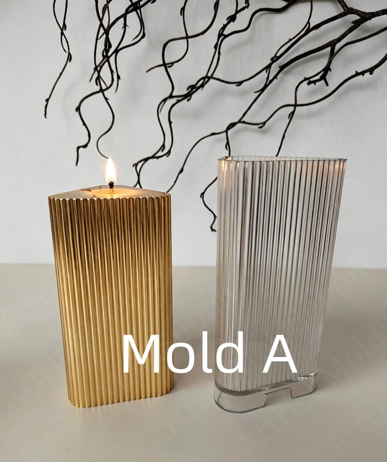 May include: A lit gold candle and a clear, ribbed, rectangular mold. The candle is burning with a bright flame. The mold is next to the candle. The text "Mold A" is in white letters.