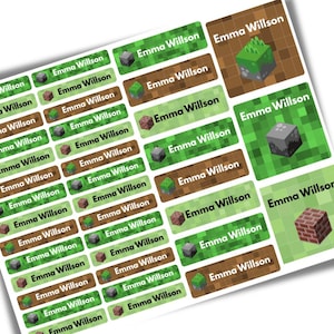 May include: A sheet of rectangular and square adhesive labels featuring the name Emma Willson printed in white or black text. The designs include pixelated patterns of green grass, brown dirt, stone blocks, and red brick blocks in a grid layout.