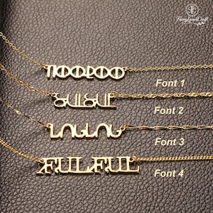 May include: Four gold-toned necklaces featuring custom name pendants in distinct typographic styles. Each necklace is labeled with text indicating Font 1, Font 2, Font 3, and Font 4, showcasing varied letterforms and chain designs.