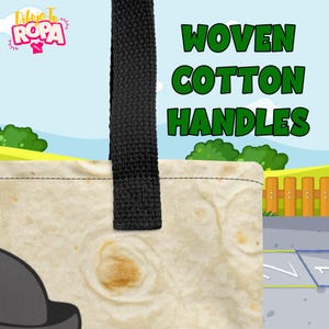 May include: A canvas tote bag with black woven cotton handles. The bag features the text "WOVEN COTTON HANDLES" in green. The bag has a light tan tortilla-like pattern. The background is a cartoon scene with a blue sky and green grass.