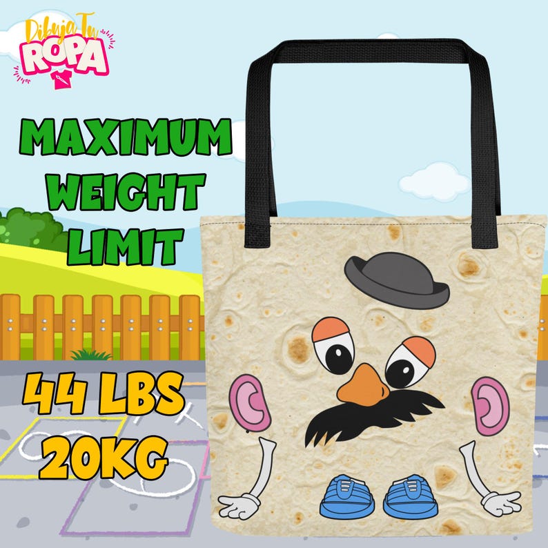 May include: A beige tote bag with a cartoon face design, black handles, and the text "MAXIMUM WEIGHT LIMIT" in green. The bag also displays "44 LBS" and "20KG". The design includes a hat, eyes, nose, mustache, ears, arms, and shoes.