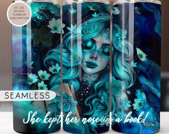 May include: A 20 ounce skinny tumbler with a sublimation design featuring a blue-haired woman with closed eyes, surrounded by blue and white flowers. The text "She kept her nose in a book!" is printed on the tumbler.