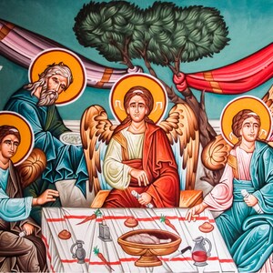 May include: A colourful painting depicting a scene of a meal with five figures. The figures are seated around a table with a bowl of food in the centre. The figures are wearing robes and have halos around their heads. The painting is done in a traditional style with bright colours and bold lines.