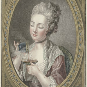 May include: A woman in a pink and white striped dress pours coffee from a blue and gold cup into another cup. The image is framed in a gold oval with blue and gold accents. The text "The Woman ta King Coffee" is below the image.