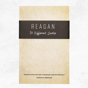 Antique colored notepad with a black belly band that says: Reagan 50 Different Quotes. A Ronald Reagan quote about freedom is written across the bottom in a typewriter font.
