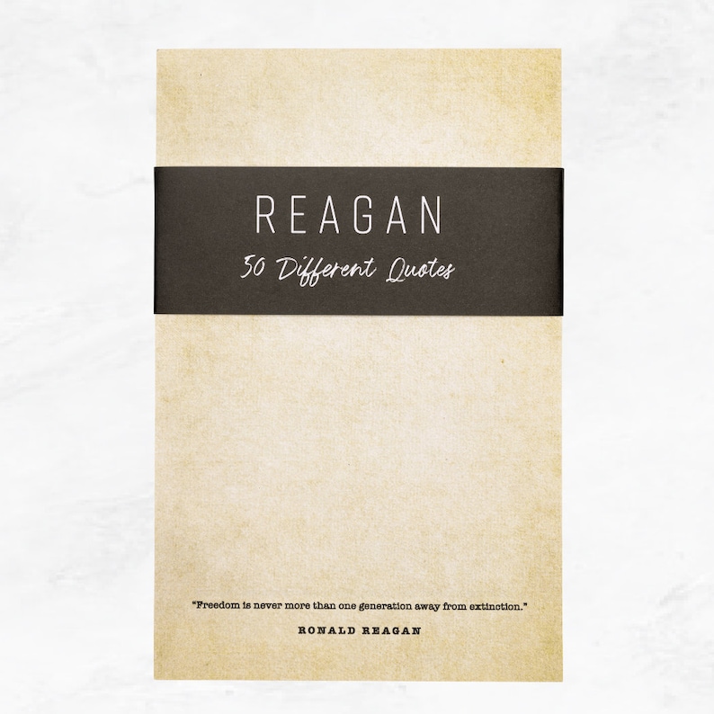 Antique colored notepad with a black belly band that says: Reagan 50 Different Quotes. A Ronald Reagan quote about freedom is written across the bottom in a typewriter font.