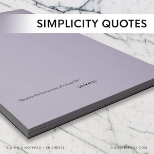 May include: A light purple notepad with the text "SIMPLICITY QUOTES" at the top. The notepad has the quote "Beware the barrenness of a busy life." by Socrates. The notepad is 5.5 x 8.5 inches and contains 50 sheets.