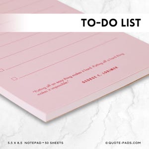May include: A pink notepad with a to-do list heading and a quote by George C. Lorimer. The quote reads, "Putting off an easy thing makes it hard. Putting off a hard thing makes it impossible."