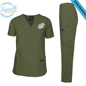 May include: A green scrub top and matching pants with a pocket on the left side of the top. The top has a V-neck and short sleeves. The text "YOUR DESIGN HERE" is embroidered on the pocket.