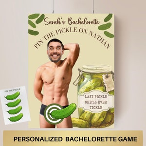 May include: A bachelorette party game with a photo of a man's torso with a pickle pinned to it. The game is called "Pin the Pickle on Nathan".