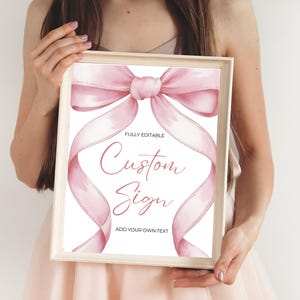 Rosa Schleife Benutzerdefiniertes Schild Vorlage Bearbeitbares Babypartyschild Gefälligkeiten Kokette Ästhetische Geschenke Schild Druckbare Tischschilder Band Mädchen-Babyparty