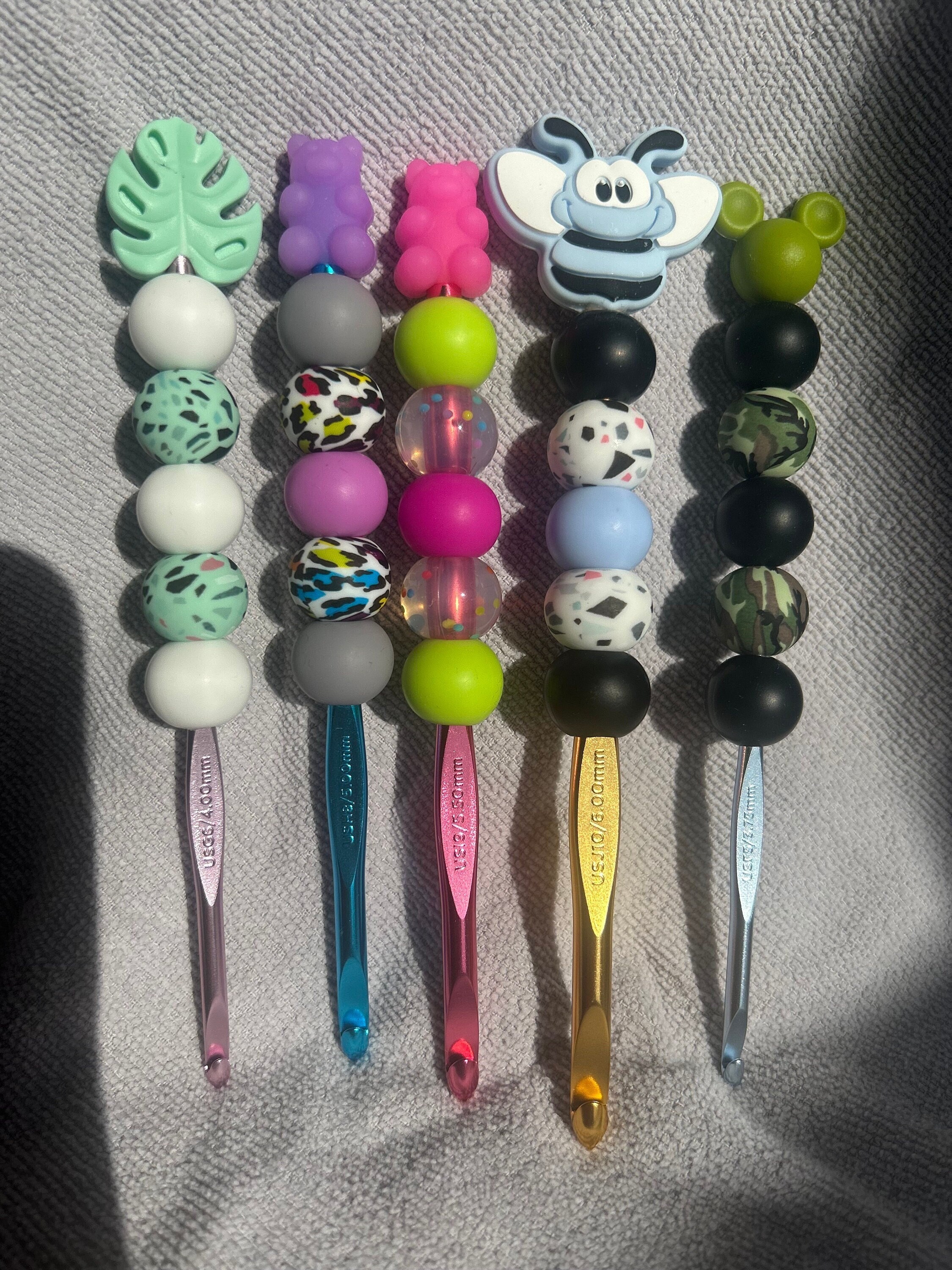 Beaded Ergonomic Crochet Hook With Silicone Beads and a Silicone Focal Bead.  This is an 8mm Size or an L Crochet Hook. 