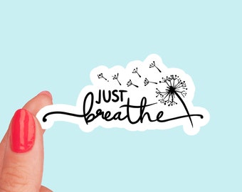 May include: White sticker with black text and a dandelion design. The text reads "JUST breathe".