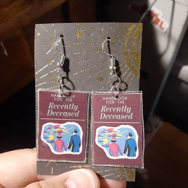 Beetlejuice inspired earrings featuring the handbook for the recently deceased unique recycled artwork turned into unique earrings