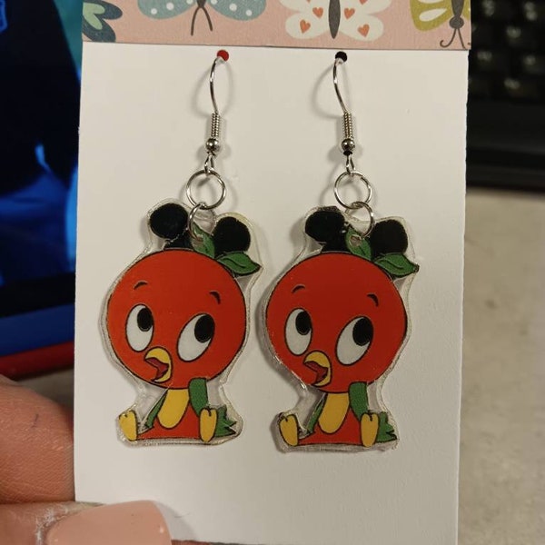 Inspired by Disney's orange juice bird this little guy is ready for flight right to your earlobes great earrings