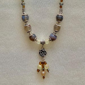 Blue banded agate and frosted glass beaded necklace.