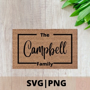 以下が含まれることがあります： 黒い長方形の枠の中に「The Campbell Family」という文字が書かれた茶色のドアマットです。