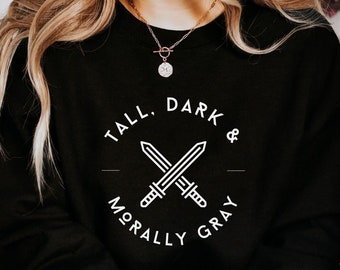 May include: Black sweatshirt with white text that reads "Tall, Dark & Morally Gray" with a graphic of two crossed swords.