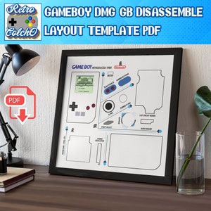May include: A black framed poster with a white background and a diagram of the Game Boy DMG GB. The diagram shows the location of the different components of the Game Boy, including the LCD circuit board, audio board, power regulator, speaker, and buttons. The text "GAME BOY INTRODUCED: 1989" is at the top of the poster.