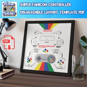 Könnte beinhalten: Ein schwarzer gerahmter Poster mit weißem Hintergrund und einem Diagramm eines Super Nintendo Controllers. Der Poster hat den Text "SUPER FAMICOM CONTROLLER DISASSEMBLE LAYOUT TEMPLATE PDF" oben und den Text "SUPER FAMICOM スーパーファミコン" in der Mitte. Der Controller ist in der Mitte des Posters mit dem Text "Nintendo" oben dargestellt.