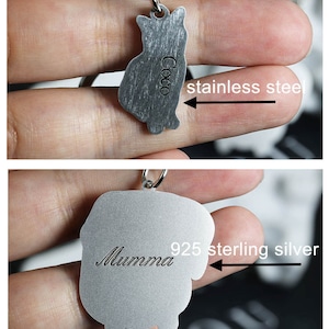 May include: Two silver pet ID tags, one with the name "Coco" engraved on a stainless steel tag, and the other with the name "Mumma" engraved on a 925 sterling silver tag.