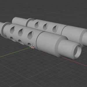 Puede incluir: Dos objetos cil&iacute;ndricos grises con una serie de agujeros en forma de l&aacute;grima a lo largo de su longitud. Cada objeto tiene una secci&oacute;n m&aacute;s ancha en ambos extremos y un cuerpo central m&aacute;s estrecho. Los objetos est&aacute;n colocados uno al lado del otro sobre una superficie gris.