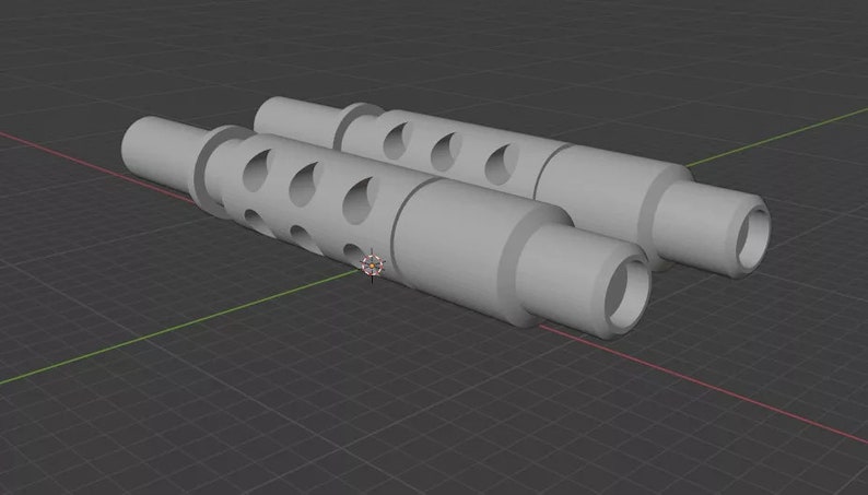 Puede incluir: Dos objetos cil&iacute;ndricos grises con una serie de agujeros en forma de l&aacute;grima a lo largo de su longitud. Cada objeto tiene una secci&oacute;n m&aacute;s ancha en ambos extremos y un cuerpo central m&aacute;s estrecho. Los objetos est&aacute;n colocados uno al lado del otro sobre una superficie gris.