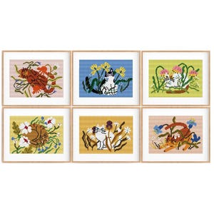 May include: Six framed illustrations of cats in a garden setting. Each illustration features a different cat breed and a variety of flowers and plants. The illustrations are in a whimsical style with bright colors and bold outlines.