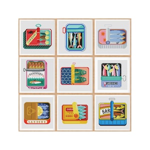 May include: Nine colourful illustrations of sardine tins with different designs and labels. The tins are arranged in a grid pattern on a wooden background.