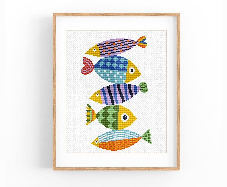 May include: A cross-stitch pattern featuring five colorful fish stacked on top of each other. The fish are in shades of blue, green, yellow, orange, and purple.