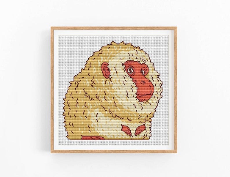 May include: A cross-stitch pattern of a white and brown monkey with a red face. The monkey is sitting with its head turned to the side.