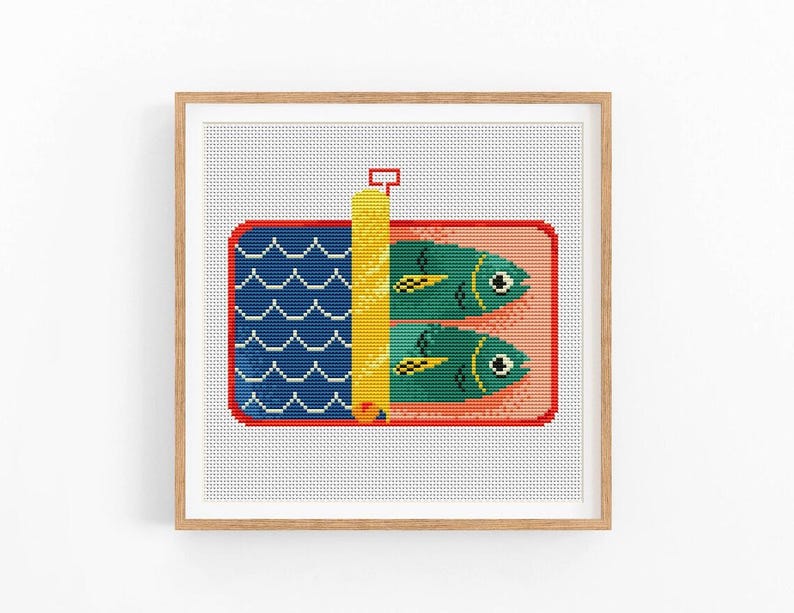 May include: Cross stitch pattern of a red and white can of sardines with a yellow key. The can is filled with two green fish with yellow fins and black eyes. The background is a blue and white wave pattern.