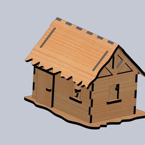 Puede incluir: Un modelo de madera de una casa con techo de paja, una puerta y una ventana. La casa est&aacute; hecha de madera marr&oacute;n claro y tiene molduras negras.