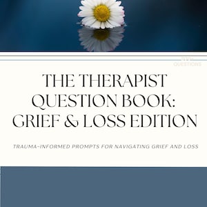 May include: A book cover with the title "THE THERAPIST QUESTION BOOK: GRIEF & LOSS EDITION". The cover features a white daisy floating on water, with the text "TRAUMA-INFORMED PROMPTS FOR NAVIGATING GRIEF AND LOSS". The Therapy Hub logo is at the top.