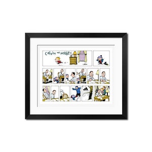 May include: A framed print of a Calvin and Hobbes comic strip. The comic strip features multiple panels depicting scenes with the characters Calvin and Hobbes. The title "Calvin and Hobbes" is written at the top of the comic strip.