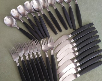 Hackman Finland set of 28 pieces,Bertel Gardberg 1950s,stainless steel and black plastic handles