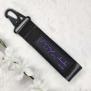 Correa para llaves, cordón y pulsera Kaomoji de mesa negra