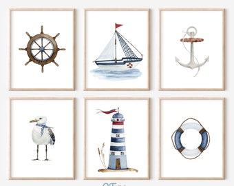 May include: Set of six nautical themed watercolor prints featuring a ship, anchor, lighthouse, life preserver, seagull, and ship's wheel.