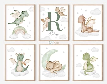 May include: Set of six watercolour prints featuring green and brown dragons with clouds and stars. The prints include a dragon flying, a dragon sleeping on a crescent moon, a dragon holding a flame, and a dragon with the letter R and the name Riley.