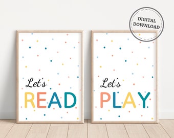 May include: Two printable posters with a white background and colourful confetti. The first poster says "Let's Read" in colourful letters. The second poster says "Let's Play" in colourful letters.